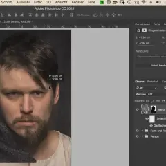 Ritratto di un uomo con barba, in fase di fotoritocco su Photoshop. Misurazioni visibili sullo schermo.
